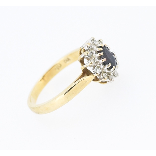 56 - Sapphire Centre Stone Ring with Diamond Set Surround Mounted in 9 Carat Yellow Gold Ring Size J and ... 