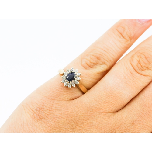 56 - Sapphire Centre Stone Ring with Diamond Set Surround Mounted in 9 Carat Yellow Gold Ring Size J and ... 
