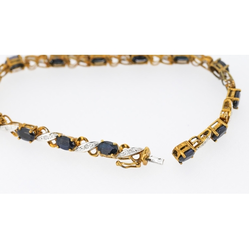 59 - Sapphire Fourteen Stone Set Crossover Link Bracelet with Diamond Insets Mounted in 9 Carat Yellow Go... 