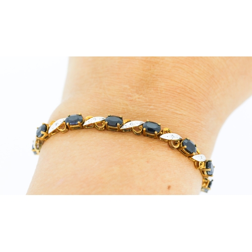 59 - Sapphire Fourteen Stone Set Crossover Link Bracelet with Diamond Insets Mounted in 9 Carat Yellow Go... 