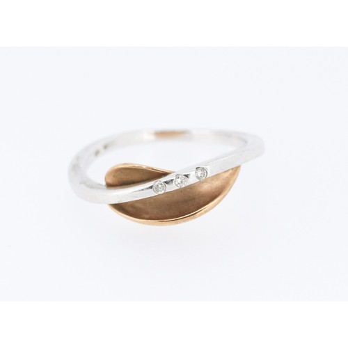 50 - Unusual Diamond Three Stone Set Ring Mounted in 9 Carat Rose and White Gold Ring Size N
