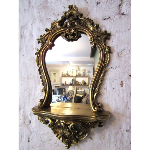 Gilded Shaped Form Wall Mirror with Integral Shelf Approximately 20 Inches High x 14 Inches Wide