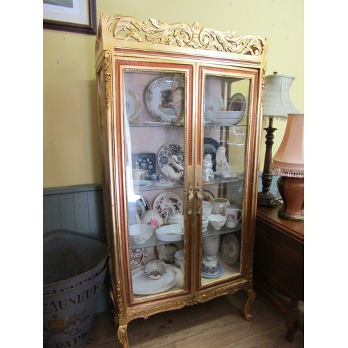 246 - Gilded Twin Door Display Cabinet with Upper Carved Decoration Approximately 40 Inches Wide x 6ft 6 I... 