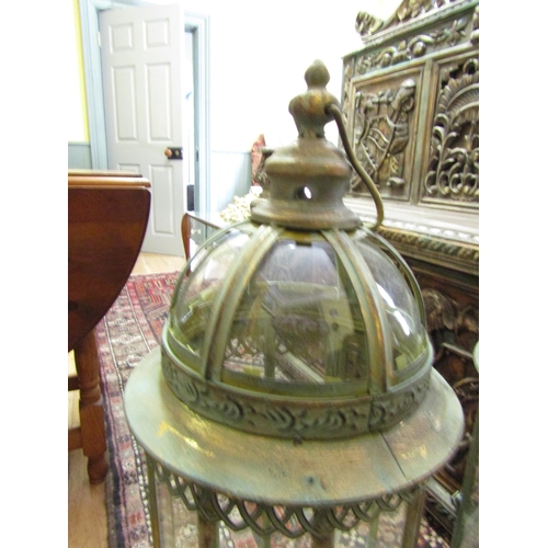 250 - Pair of Glazed Metal Lanterns on Shaped Supports each Approximately 32 Inches High