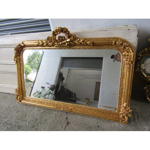 258 - Gilded Rectangular Form Wall Mirror with Upper Carved Decoration Approximately 56 Inches Wide x 2ft ... 