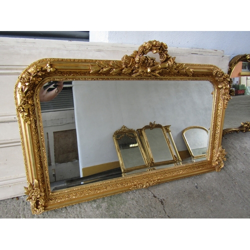 258 - Gilded Rectangular Form Wall Mirror with Upper Carved Decoration Approximately 56 Inches Wide x 2ft ... 
