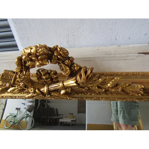 258 - Gilded Rectangular Form Wall Mirror with Upper Carved Decoration Approximately 56 Inches Wide x 2ft ... 