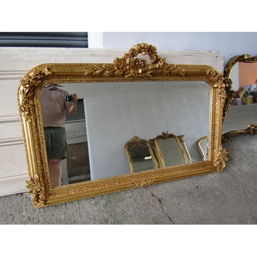 258 - Gilded Rectangular Form Wall Mirror with Upper Carved Decoration Approximately 56 Inches Wide x 2ft ... 