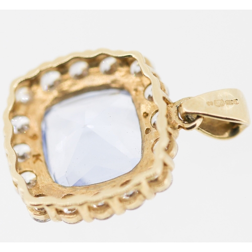 12 - Aquamarine Set Pendant with White Topaz Set Surround Mounted in 9 Carat Yellow Gold 1.5cm High