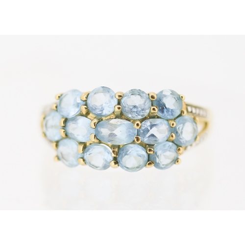 2 - Blue Topaz Set Cluster Ring with Diamond Inset to Shoulders Mounted in 9 Carat Yellow Gold Ring Size... 