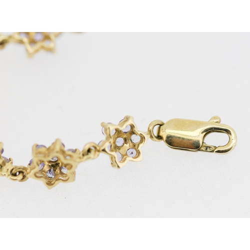 21 - Pale Tanzanite Cluster Daisy Form Set Bracelet Mounted in 9 Carat Yellow Gold 18.5cm Long
