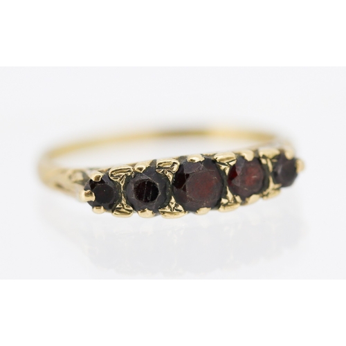 22 - Garnet Set Five Stone Graduated Form Ring Mounted in 9 Carat Yellow Gold Ring Size V