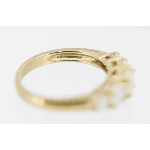 25 - Opal Five Stone Graduated Form Ring Mounted in 9 Carat Yellow Gold Ring Size L and a Half