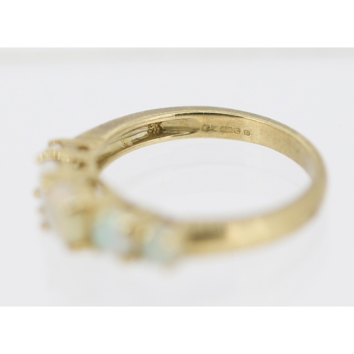 25 - Opal Five Stone Graduated Form Ring Mounted in 9 Carat Yellow Gold Ring Size L and a Half