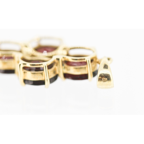 54 - Red Garnet Four Stone Set Pendant Mounted in 9 Carat Yellow Gold 2.5cm High