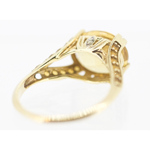 57 - Citrine Set Ring with Further Citrine and Diamond Inset to Shoulders Mounted in 9 Carat Yellow Gold ... 