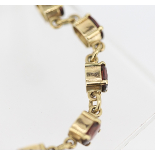 59 - Garnet Eleven Stone Set Bracelet Mounted in 9 Carat Yellow Gold with Safety Chain 16.5cm Long
