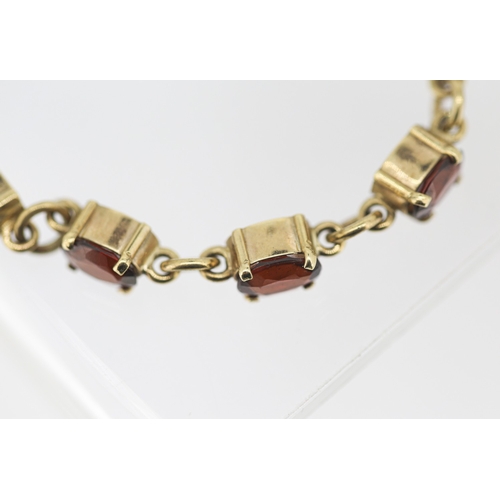 59 - Garnet Eleven Stone Set Bracelet Mounted in 9 Carat Yellow Gold with Safety Chain 16.5cm Long