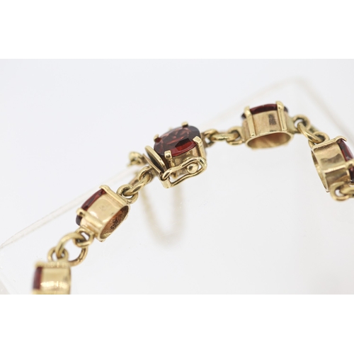 59 - Garnet Eleven Stone Set Bracelet Mounted in 9 Carat Yellow Gold with Safety Chain 16.5cm Long