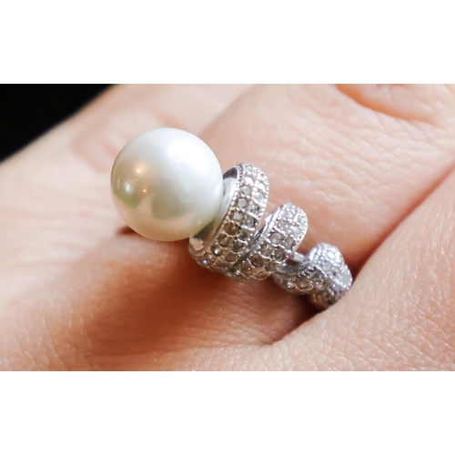 78 - Pearl and Diamond Set Ladies Ring Mounted on Silver Band Size N