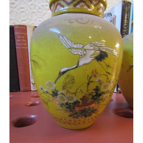 83 - Pair of Eastern Vases with Covers Yellow Ground with Avian Motif Decoration Each Approximately 9 Inc... 