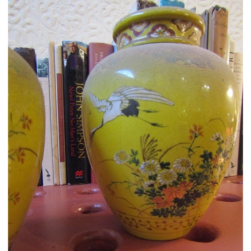 83 - Pair of Eastern Vases with Covers Yellow Ground with Avian Motif Decoration Each Approximately 9 Inc... 
