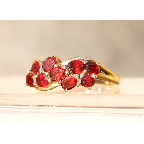 10 - Nine Stone Red Garnet Set Cluster Ring Mounted in 9 Carat Yellow Gold Ring Size P