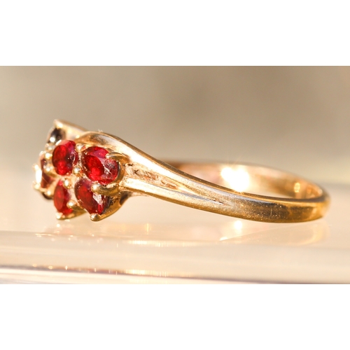 10 - Nine Stone Red Garnet Set Cluster Ring Mounted in 9 Carat Yellow Gold Ring Size P