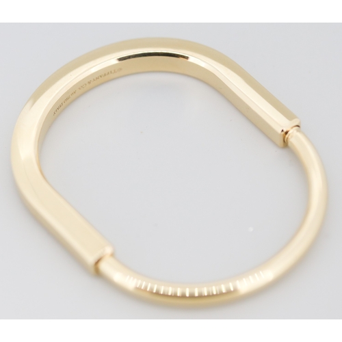 11 - Tiffany & Co 18 Carat Yellow Gold Tiffany Lock Bangle Inner Width 5.5cm with Original Presentation C... 