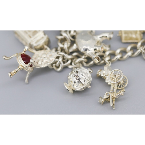 111 - Silver Charm Bracelet with Eleven Charms Heart Padlock Clasp and Safety Chain 18.5cm Long