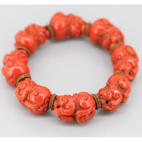 119 - Attractively Detailed Carved Red Coral Pixiu Feng Shui Bracelet