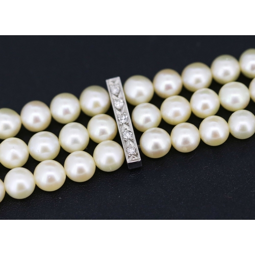 12 - Platinum Mounted Diamond Set Three Strand Pearl Bracelet 18cm Long