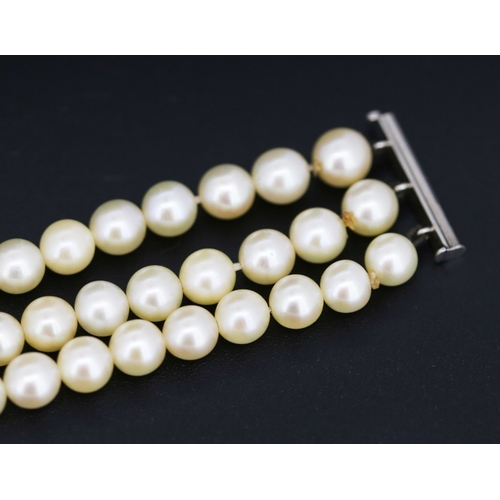 12 - Platinum Mounted Diamond Set Three Strand Pearl Bracelet 18cm Long