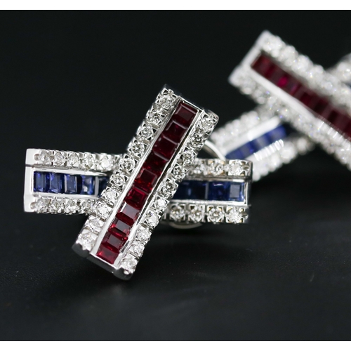 13 - Pair of Attractively Detailed Baguette Cut Ruby, Sapphire and Round Cut Diamond Set Cross Over Earri... 