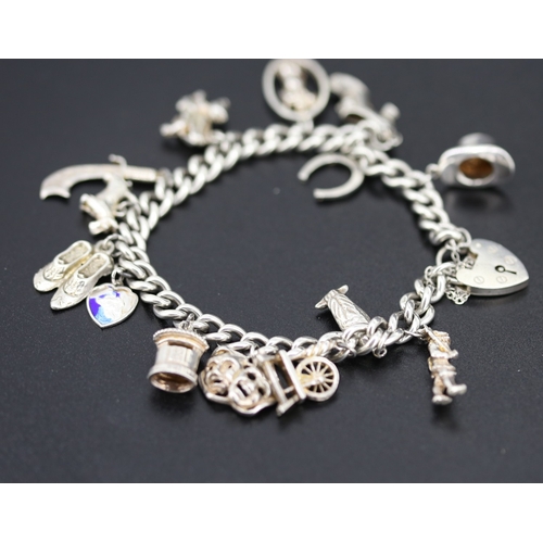 Silver Charm Bracelet with Fourteen Charms Heart Padlock Clasp and Safety Chain 21cm Long