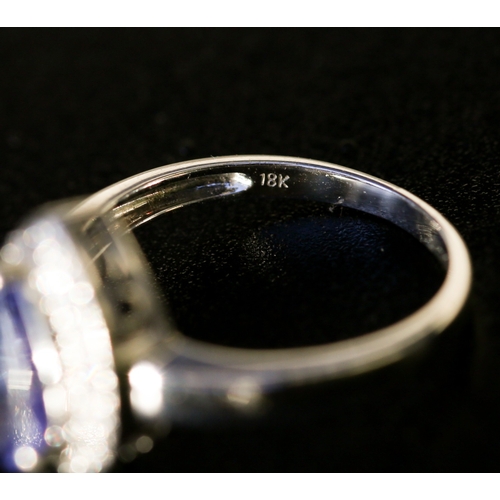 25 - Pear Cut Tanzanite Set Ring with Diamond Inset Surround Mounted in 18 Carat White Gold Ring Size O a... 