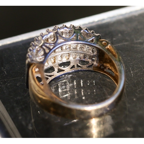 28 - Channel Set Tapered Baguette Cut Diamond Multi Row Cluster Ring Mounted in 10 Carat Yellow Gold Ring... 