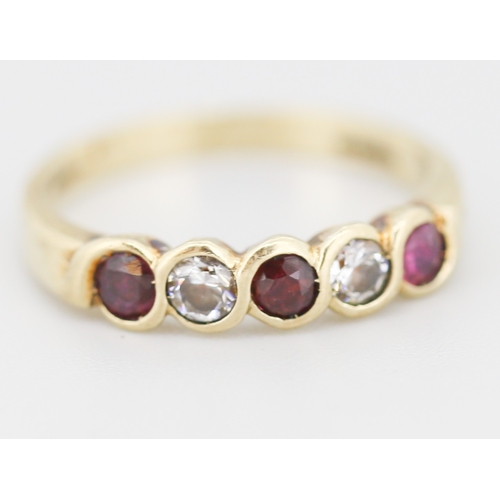 282 - Ruby and Cubic Zirconia Set Five Stone Ring Mounted in 9 Carat Yellow Gold Ring Size N
