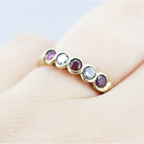282 - Ruby and Cubic Zirconia Set Five Stone Ring Mounted in 9 Carat Yellow Gold Ring Size N