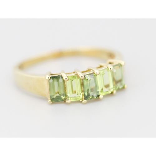 284 - Emerald Cut Peridot and Demantoid Set Five Stone Ring Mounted in 9 Carat Yellow Gold Ring Size S