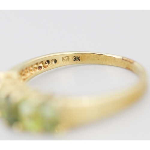 284 - Emerald Cut Peridot and Demantoid Set Five Stone Ring Mounted in 9 Carat Yellow Gold Ring Size S