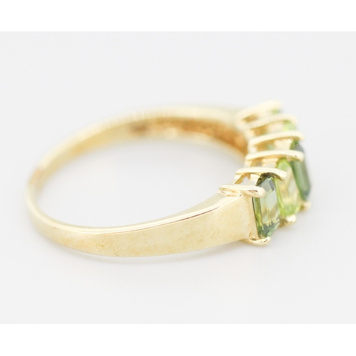 284 - Emerald Cut Peridot and Demantoid Set Five Stone Ring Mounted in 9 Carat Yellow Gold Ring Size S