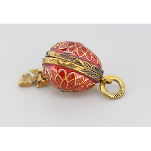 289 - Enamel Decorated Russian Silver Gilt Egg Pendant with Hidden Angel Drop Charm 2cm