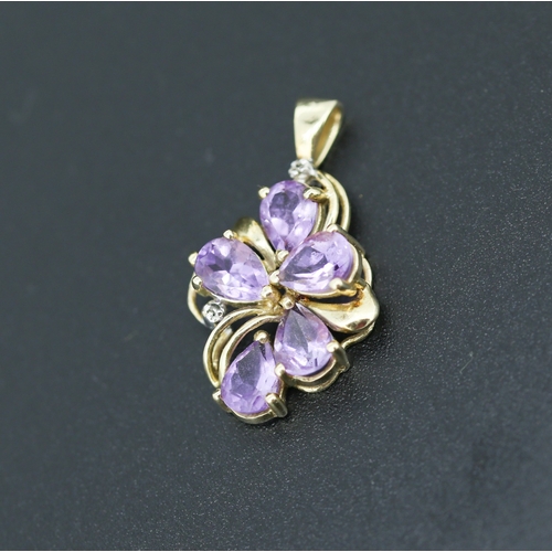 295 - Pear Cut Amethyst Five Stone Set Floral Motif Pendant with Further Diamond Inset Mounted in 14 Carat... 