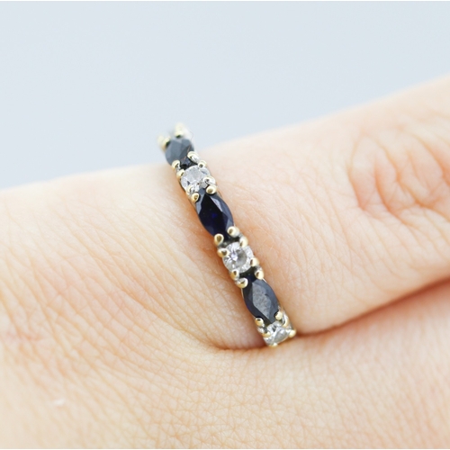 301 - Sapphire and Gemset Seven Stone Set Ring Mounted in 9 Carat Yellow Gold Ring Size M and a Half