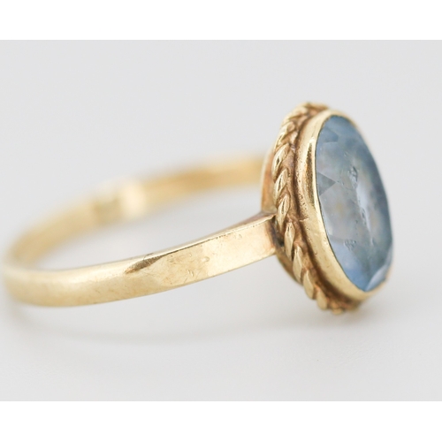 302 - Aquamarine Bezel Set Single Stone Ring Mounted in 9 Carat Yellow Gold Ring Size O and a Half