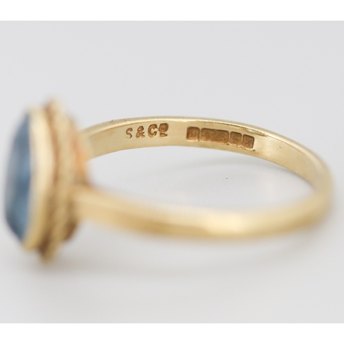 302 - Aquamarine Bezel Set Single Stone Ring Mounted in 9 Carat Yellow Gold Ring Size O and a Half