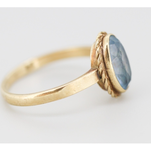 302 - Aquamarine Bezel Set Single Stone Ring Mounted in 9 Carat Yellow Gold Ring Size O and a Half