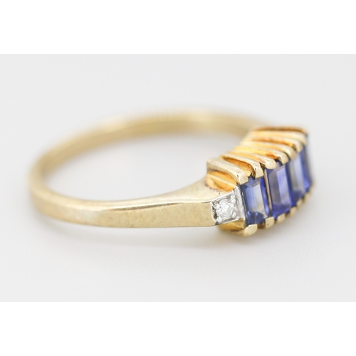 312 - Sapphire Baguette Cut Four Stone Set Ring with Diamond Inset to Shoulders Mounted in 9 Carat Yellow ... 