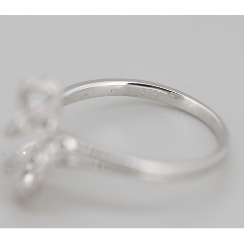 314 - Unusual Form Diamond Set Swirl Motif Ring Mounted in 9 Carat White Gold Ring Size O